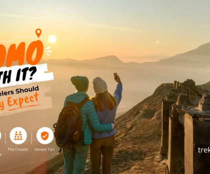 Traveler enjoying the sunrise view over Mount Bromo, Mount Batok, and the Tengger Caldera in East Java, Indonesia.