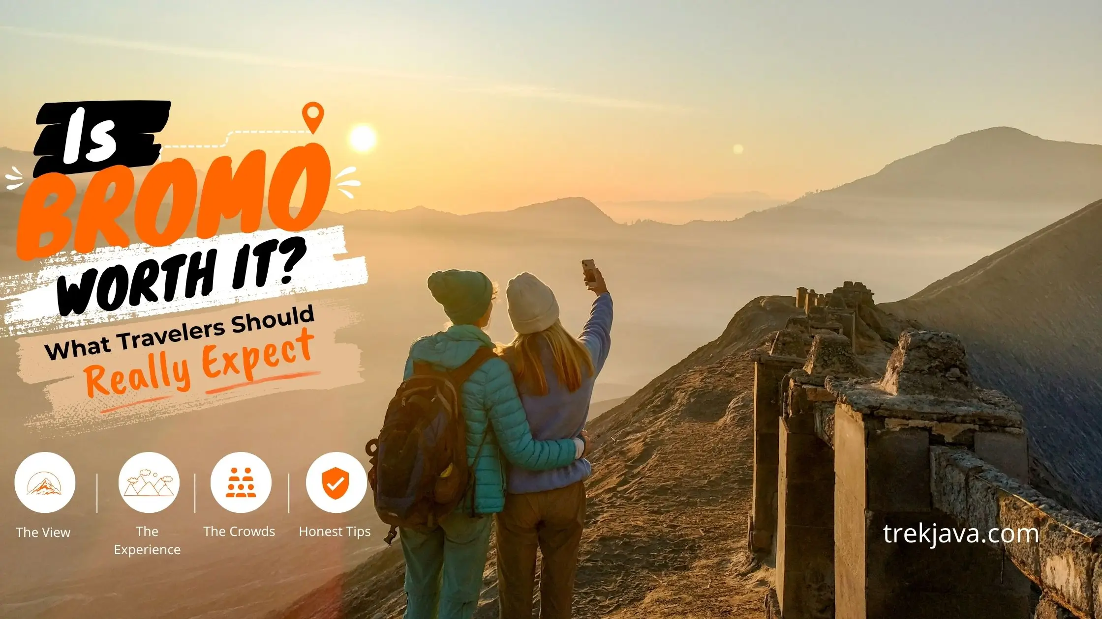 Traveler enjoying the sunrise view over Mount Bromo, Mount Batok, and the Tengger Caldera in East Java, Indonesia.
